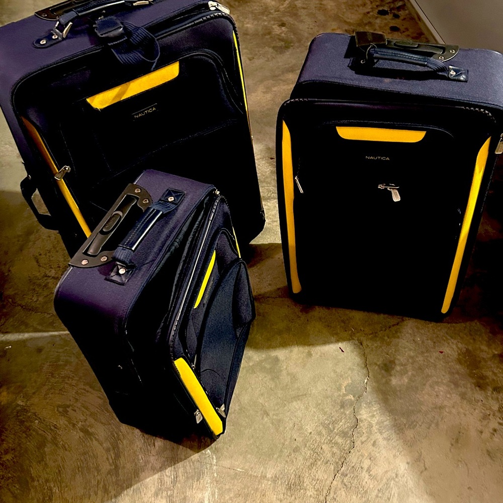 Navy and Yellow NAUTICA luggage slightly used and in still great condition.